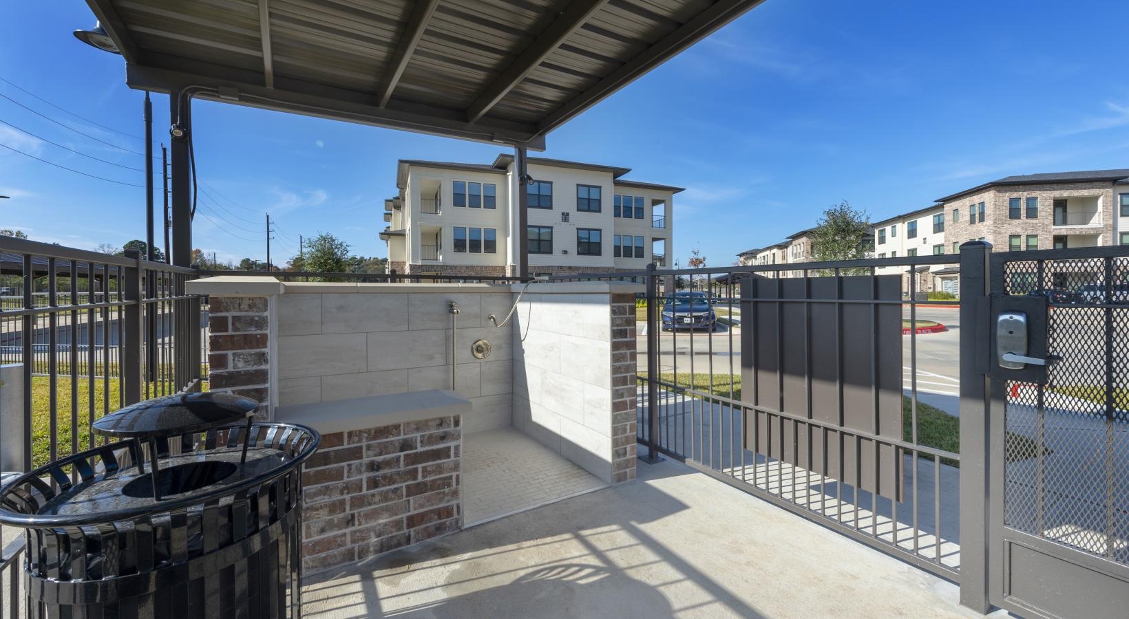 Find your perfect fit at Berkshire Exchange a fenced off area with a building in the background