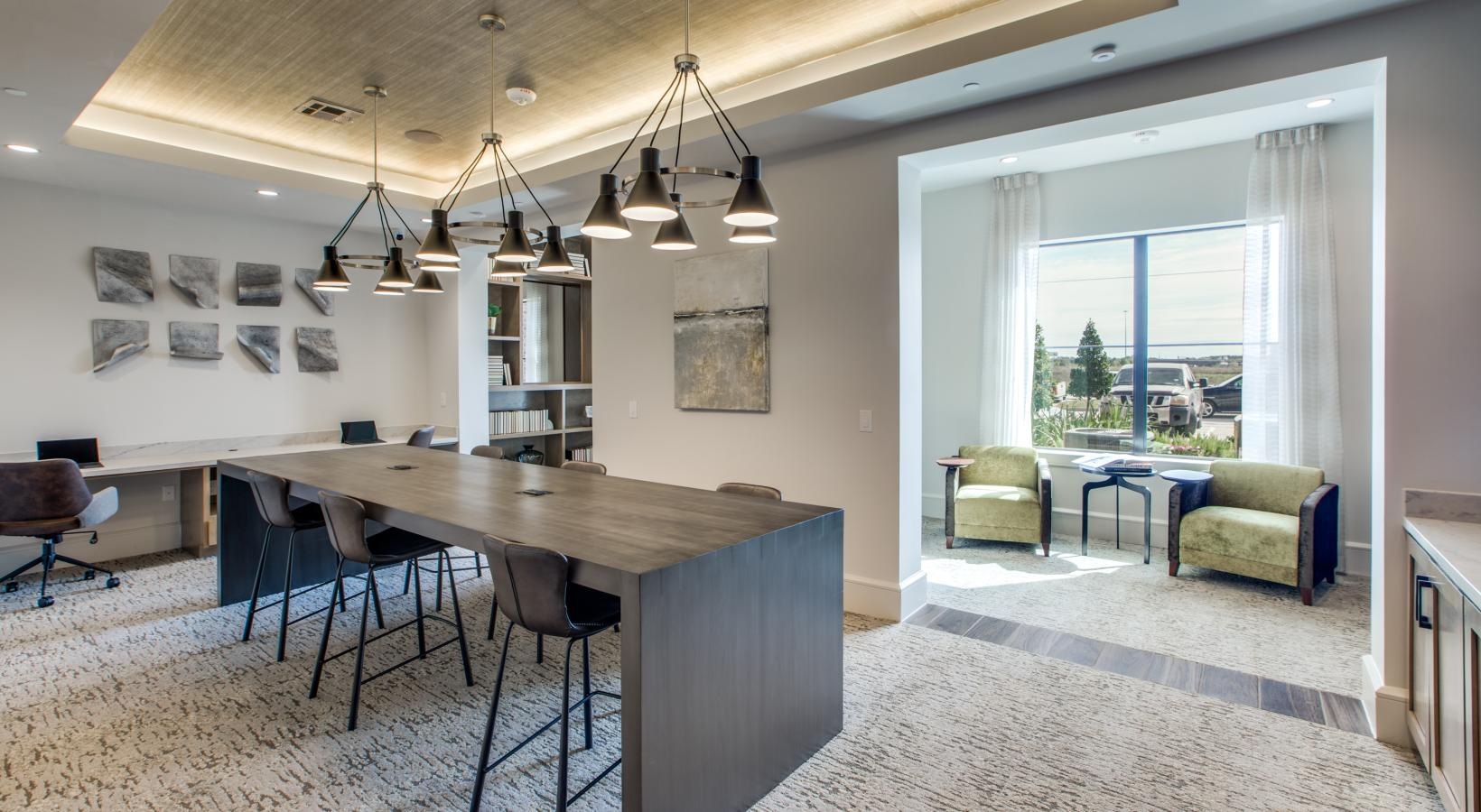 Find your perfect fit at Berkshire Exchange a dining room with a chandelier and chairs
