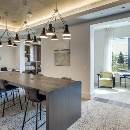 Find your perfect fit at Berkshire Exchange a dining room with a chandelier and chairs