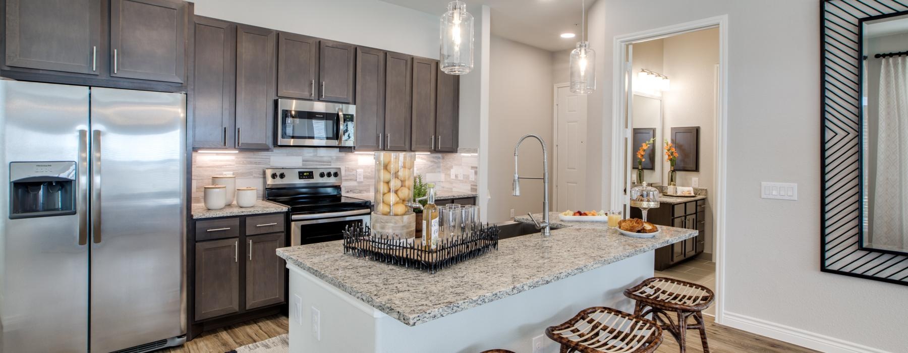 a kitchen with a marble island