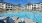 a pool with chairs around it
