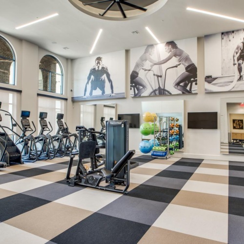 Cutting-edge amenities at your fingertips a gym with exercise equipment