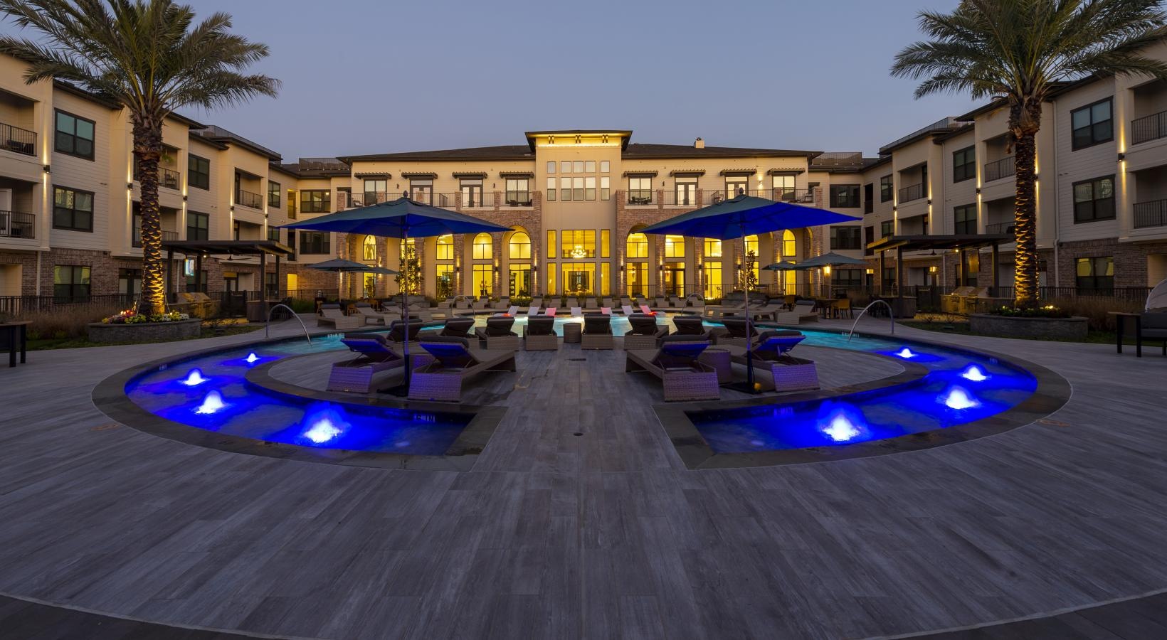 Settle into comfort at Berkshire Exchange a pool in front of a building