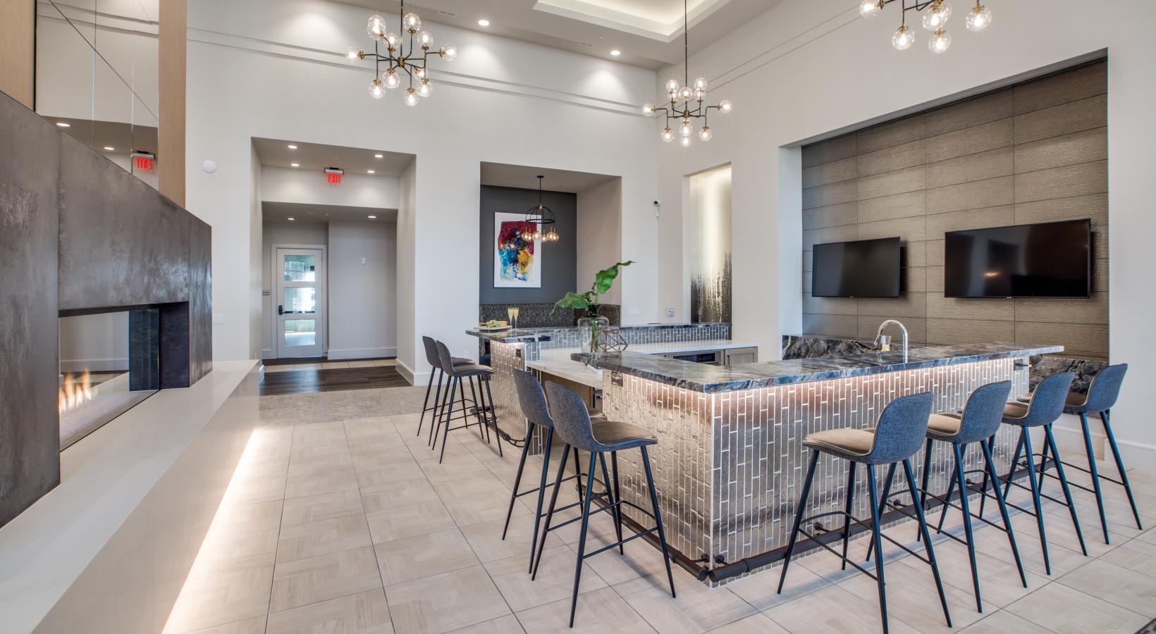 Find your perfect fit at Berkshire Exchange a kitchen with a bar and chairs